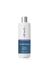 A front facing white 16 ounce bottle of ibd LED Shine Enhancer with a metallic silver cap